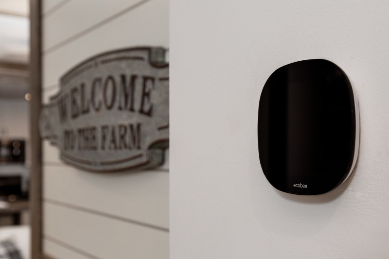 An ecobee smart thermostat® installed on the wall of a manufactured home.