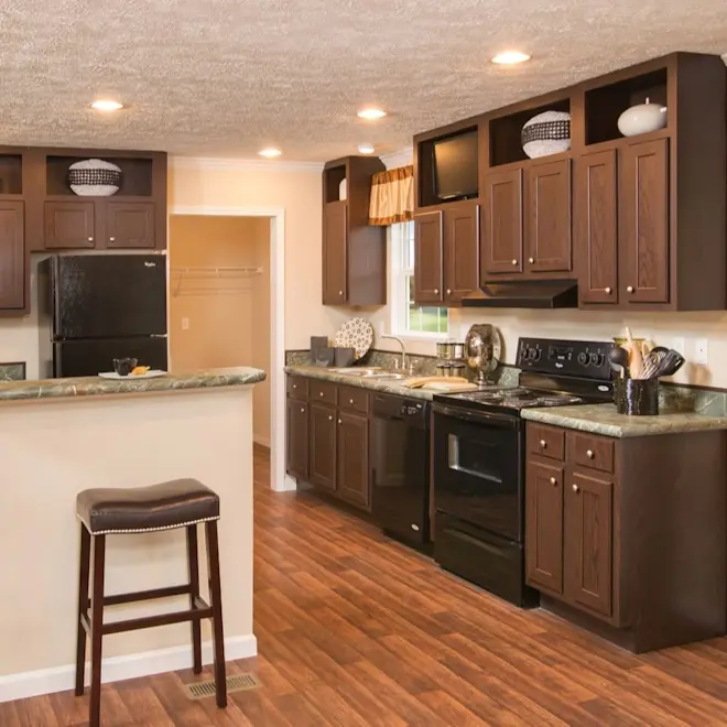 Offering gorgeous wood cabinetry, stainless steel range hood and sleek countertops, The Elite 52 has a beautiful yet functional kitchen space.