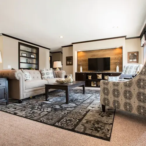 The living room in The Washington (Patriot) GW features a built-in entertainment center and recessed lighting.