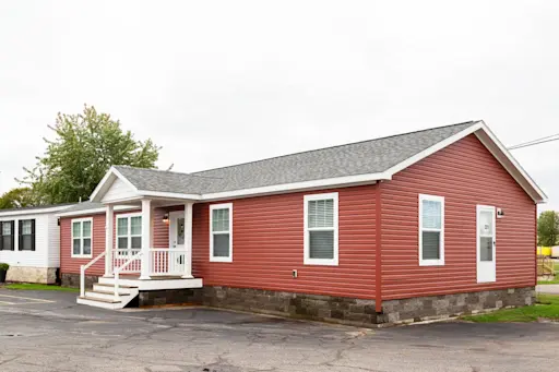 The Michigan AVE 6028-MS026 Sect exterior features a focal point porch that brightens up the front of this home and adds to its curb appeal.