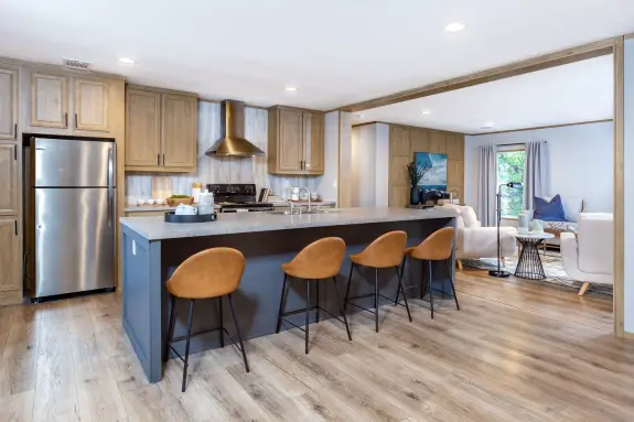 The Everest will be climbing your list of homes when you see its beautiful design. Stainless steel appliances, a long blue kitchen island, wood style floors and a floor plan with split bedrooms are just a few of the features you'll love.