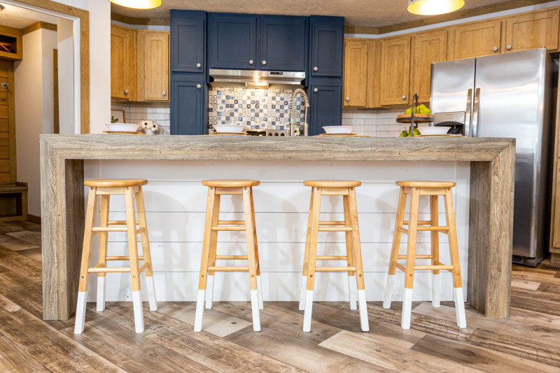Kitchen of the Kimmel model with a shiplap-front kitchen island.