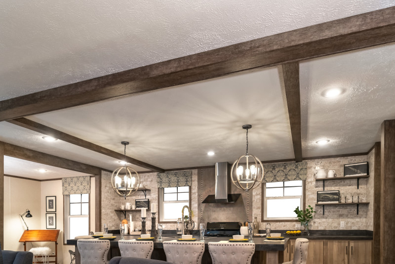 Manufactured home ceiling with wooden beams.