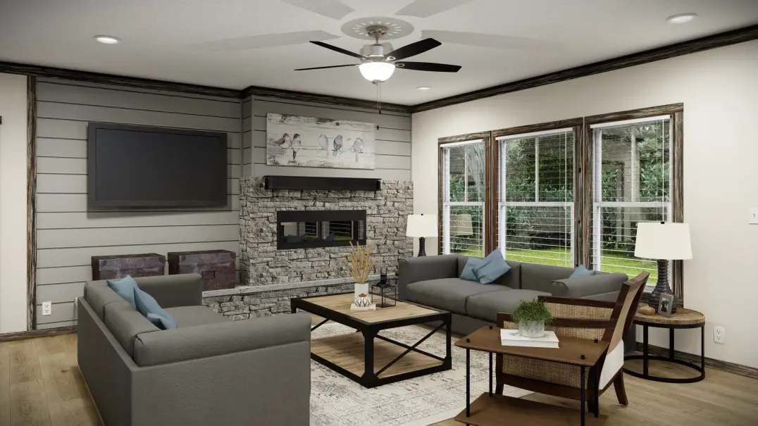 Living room with stone fireplace and large picture windows