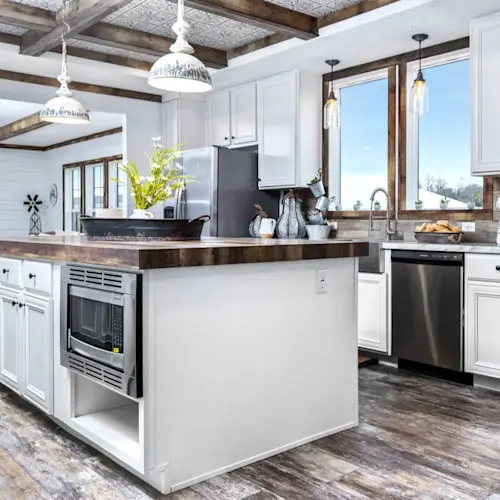 The kitchen in The Liza Jane features a tin coffered ceiling and a large island.