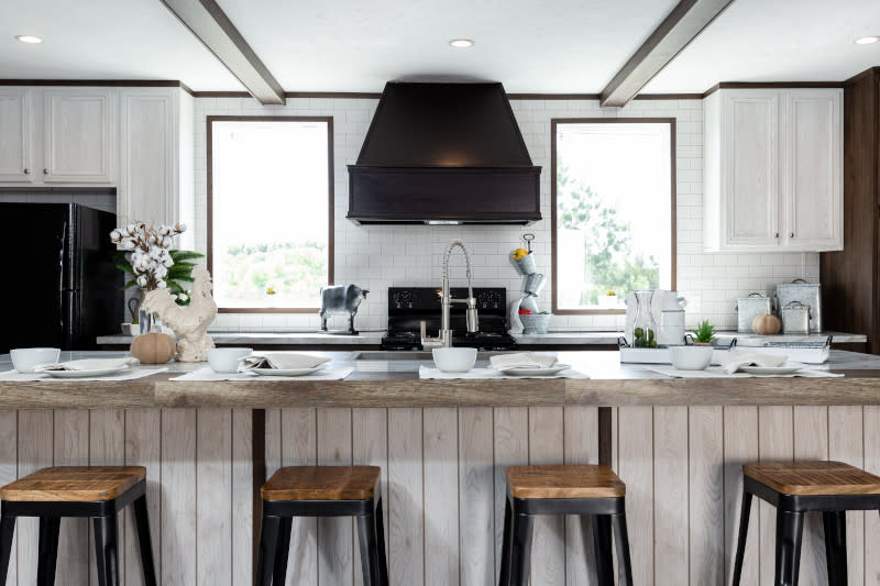 Kitchen Utensils With Stove On Wooden Countertop And White Tiled