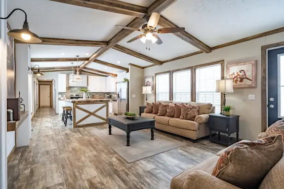 The Bobby Jo is rustic and charming with a vaulted ceiling with beams and tall windows.
