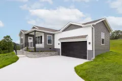 A home shown from the side with white and gray alternating siding, an attached garage, a rail-surrounded porch and brick and stucco skirting.