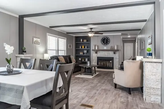 The [model name] features a fireplace and ceiling beams.