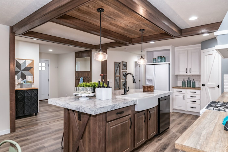 A large farmhouse style kitchen in the Fifth AVE manufactured home model.