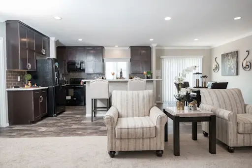 Want a larger home with a classic look? The K3076B will wow with dark cabinets, marble style counters, crown molding and recessed lighting.