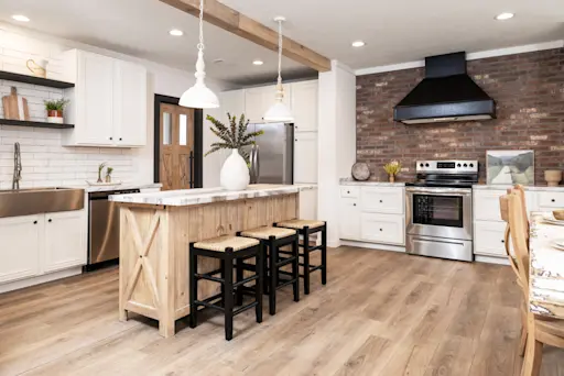 The Anna FAE is a modern farmhouse with brick and shiplap backsplash and a walk-in pantry.
