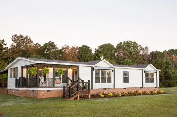 Bright whites, covered porch, wood beam style columns must we go on? The exterior front porch on the Lulamae has it all and then some.