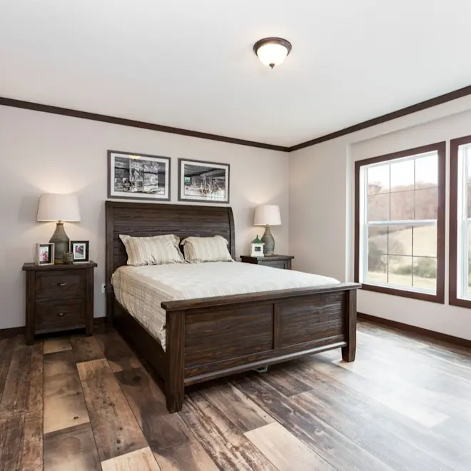 Is there a wrong side of the bed to wake up on in The Avalyn primary bedroom? Natural light and wood grain laminate floors gives this bedroom a unique look you'll love waking up in. 