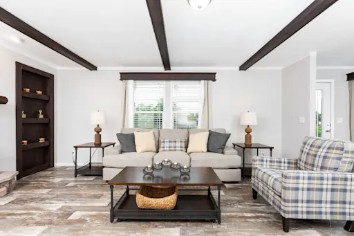 The Tahoe is oh-so-lovely, and we adore the darker wood accents in this larger home, including the built-in shelving, ceiling beams and window cornices.