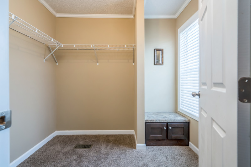 Large walk-in closet with area to sit