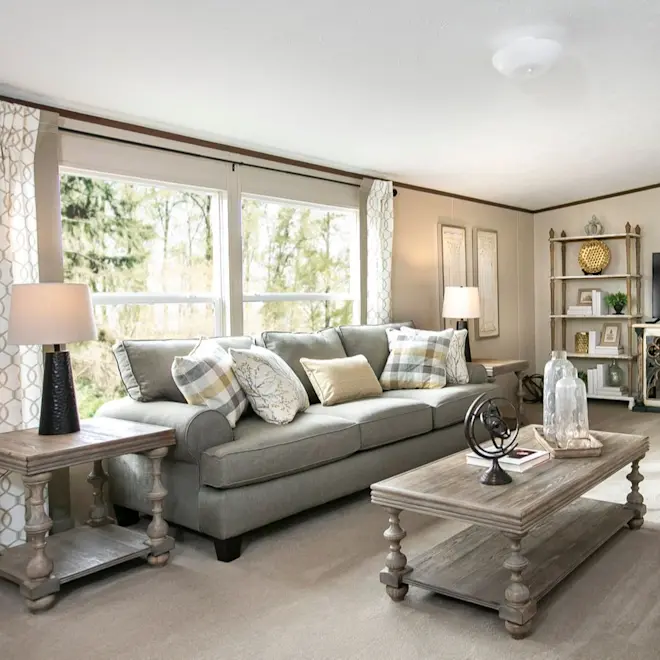 This living room space in the Triumph marries natural light with neutral tones for a bright and airy space.