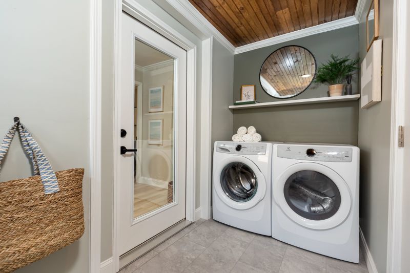 Laundry room with glass door and textured ceiling