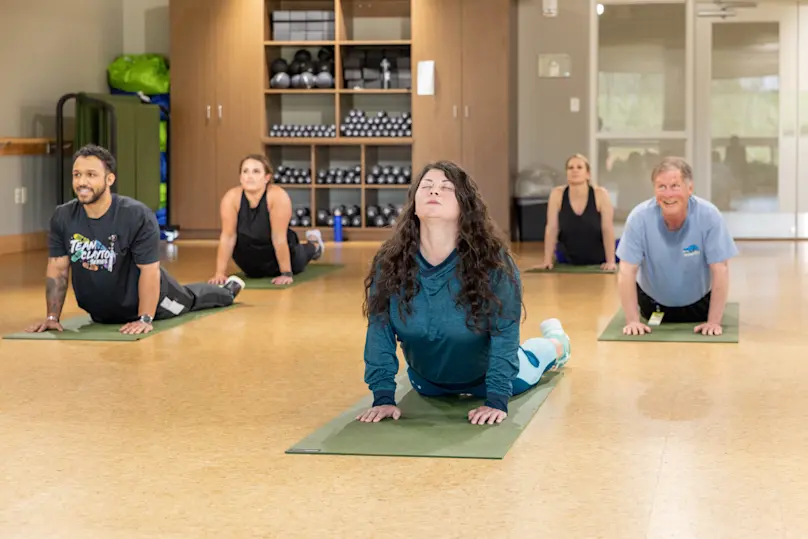 Clayton team members participate in a yoga class