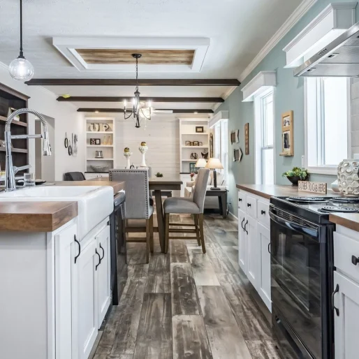 [Model Name] features a cozy cottage interior, butcher block style countertops and plenty of natural light in the kitchen to make every day bright.
