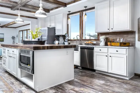 Taking the best of farmhouse design, this large, open kitchen is all charm. The Liza Jane has all the storage and space you need.