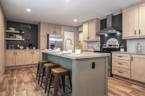 The [model name] features a kitchen with a large island and coffee bar.