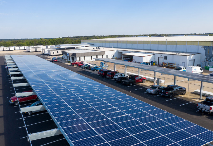 Solar panel parking at Clayton Sulphur Springs provides shaded parking spaces for team members and a sustainable source of energy for the home building facility