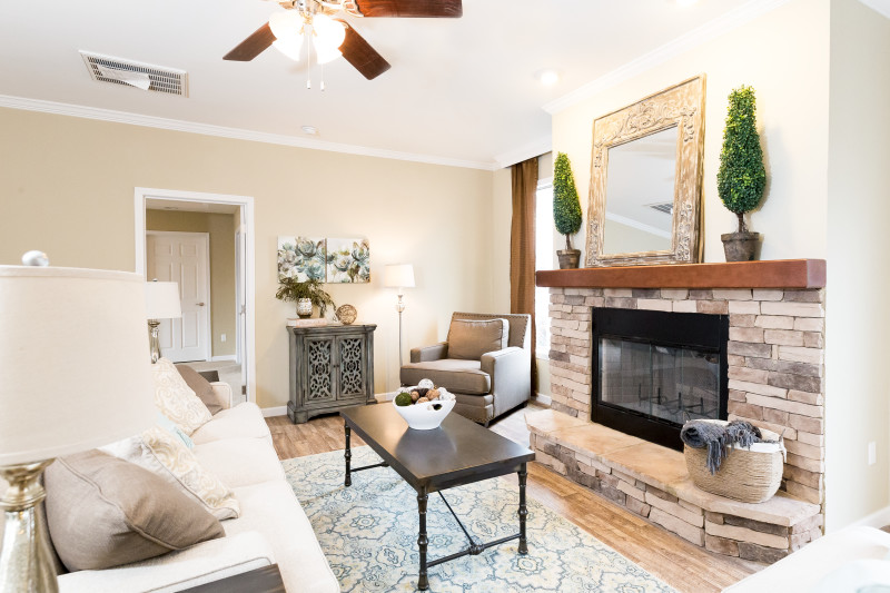 Living area of the Greystone with fireplace feature and modern decoration.