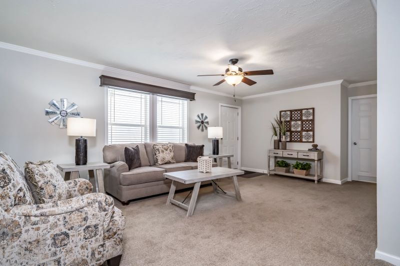 Light airy living room with ceiling fan