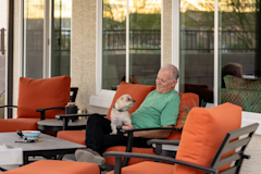 Don and his dog Munkee sitting on the patio together