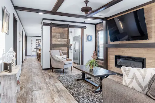 The Boujee XL 2 features a family room off the kitchen and a modern electric fireplace.