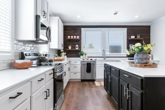 Shiplap style walls, floating shelves, subway tile backsplash and barn style doors in the Sedona home make it a farmhouse dream! Explore farmhouse homes near me to browse more Clayton homes.