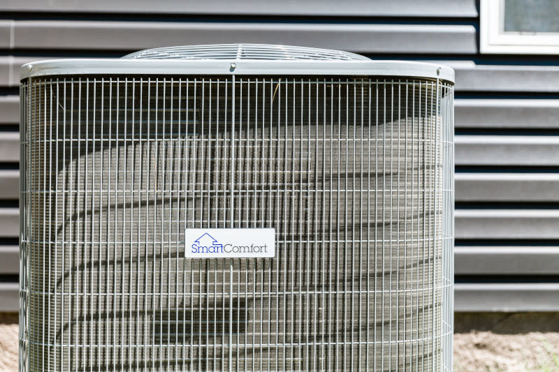 SmartComfort® air conditioning unit outside of a manufactured home.