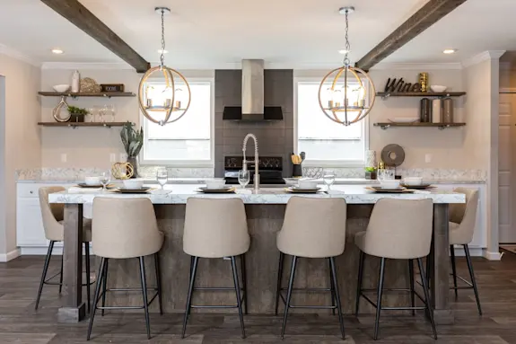 You'll love the elegant and elevated style found throughout the kitchen of The Freedom Soho floor plan, featuring wood style beams and open shelving!