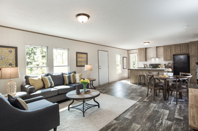 Open floor plan with living room, dining room, and kitchen in view