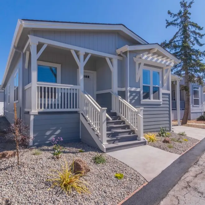 The calming grey siding paired with white exterior details is a match made in heaven on Coronado 2456B exterior. 