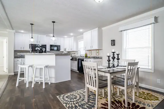 The Tucson features a kitty-cornered kitchen island that creates a clear divide between the rooms in your home while still letting you enjoy an open floor plan.