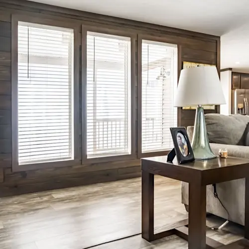 With The Turner, the best part of the huge living room is the wood accent wall with three windows leading out to your private, inset back porch.