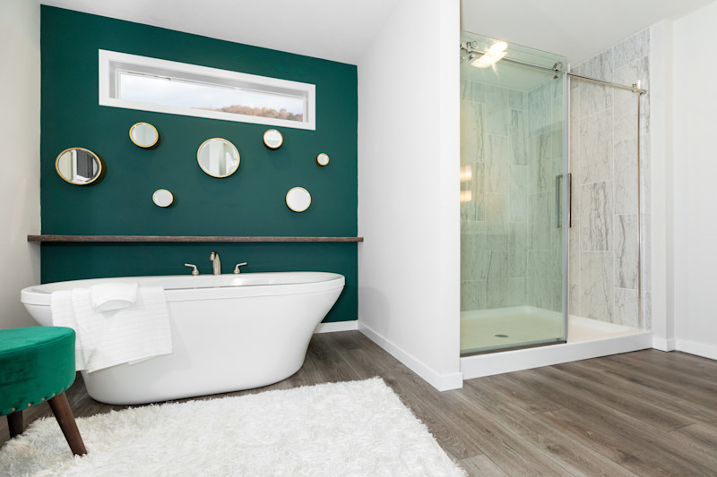 Primary bathroom with a large soaker tub and walk-in shower.