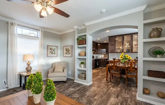The K1676H has beautiful design details like shelves built-in to an arched entryway and glass cabinets in the dining room hutch.