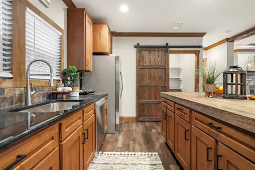The Durango is full of rustic charm with warm wood cabinetry and a walk-in pantry.