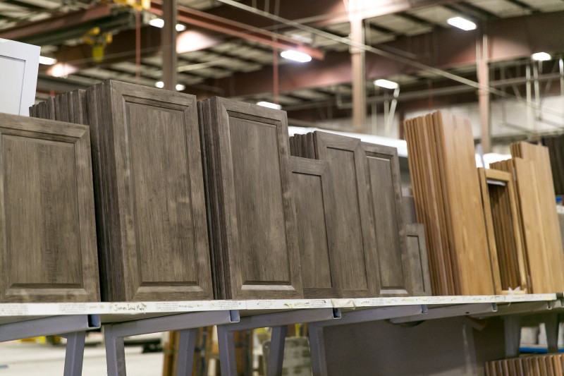 Stacks of finished cabinetry waiting to be assembled on a manufactured home.