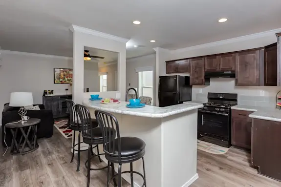 The K1668A features an open floor plan with a partition window wall and crown molding.