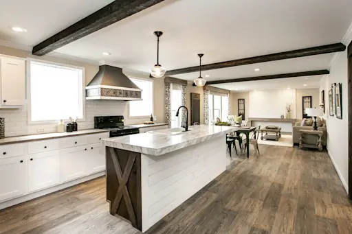 Get the classic, clean farmhouse look with beautiful accents like a stylish range hood and wood style beams in the Freedom Farm House 32X60.