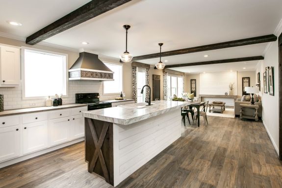 Get the classic, clean farmhouse look with beautiful accents like a stylish range hood and wood style beams in the Freedom Farm House 32X60.