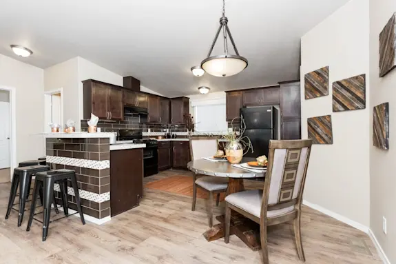 The K2744 is an elegant smaller home. with vaulted ceilings, gorgeous tile overlays, wood style floors and half dome lights.