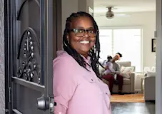 Theresa Williams standing at her front door