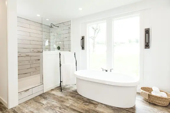 Find your daily peace in the primary bathroom of the Lulamea. Picture yourself soaking in the tub while enjoying a sunset out the windows or starting your morning routine in the walk-in shower with a rainfall shower head.