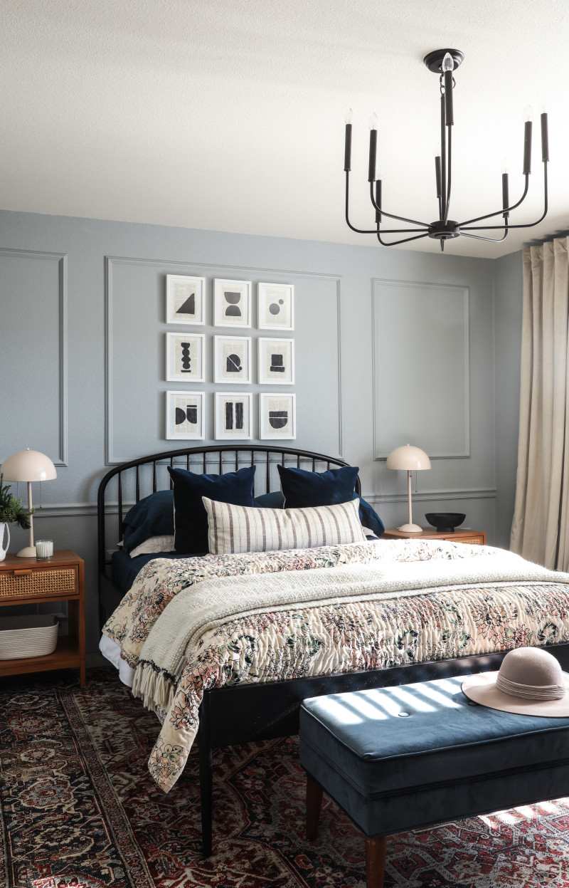 Master bedroom remodel with modern chandelier, iron bedframe and boho furniture