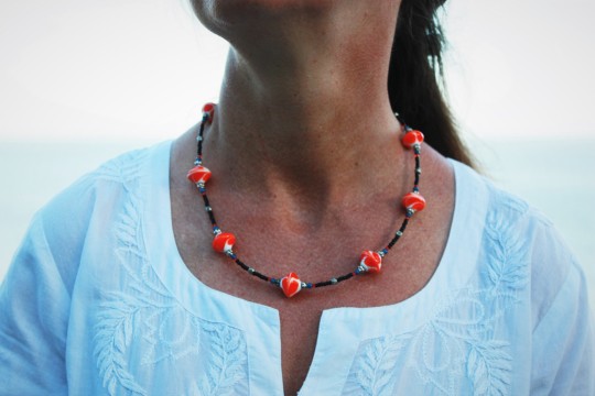 Collier "les petites toupies orange" 